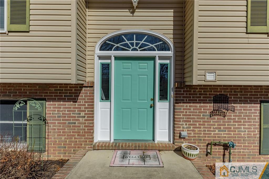 12 Thompson Bridge Road Jackson, NJ 08527 - Photo 2 of 25 a front view of a house with a garden
