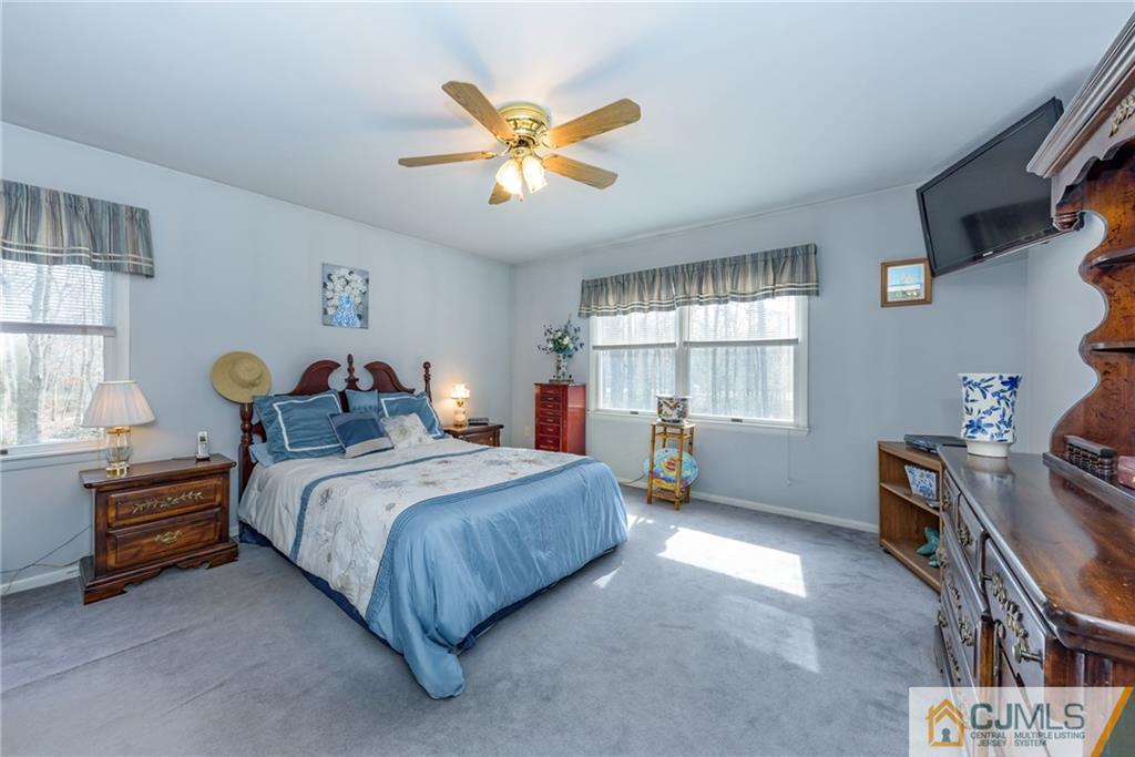 12 Thompson Bridge Road Jackson, NJ 08527 - Photo 11 of 25 a bedroom with a bed and window
