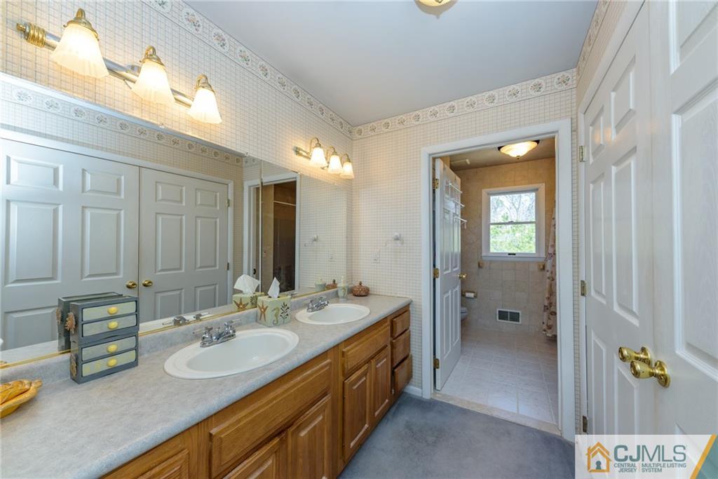 12 Thompson Bridge Road Jackson, NJ 08527 - Photo 13 of 25 a bathroom with a double vanity sink and mirror