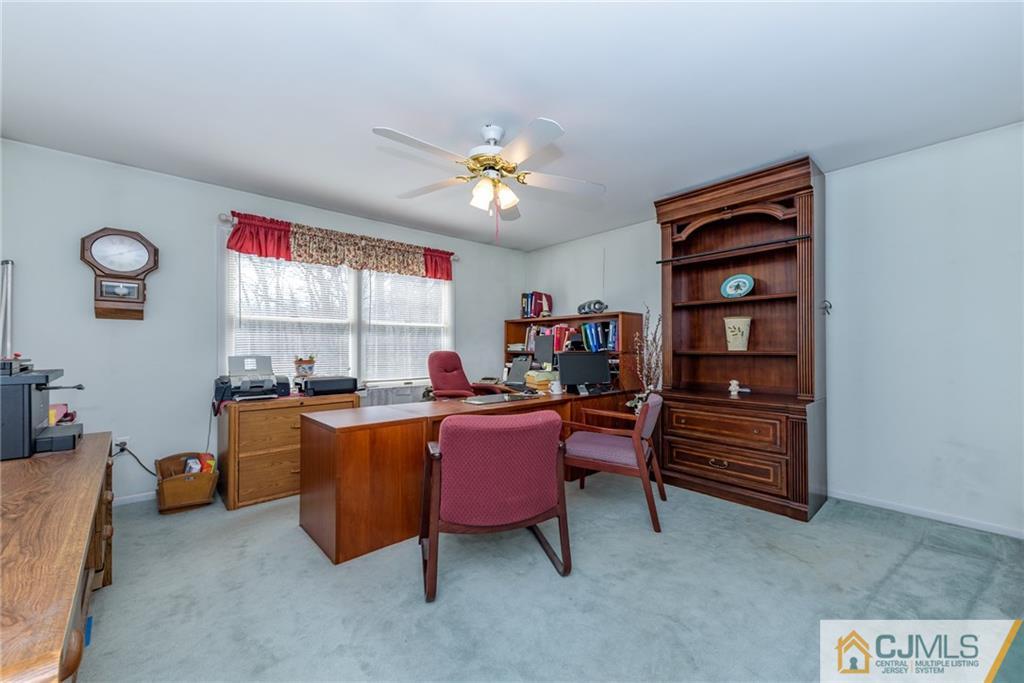 12 Thompson Bridge Road Jackson, NJ 08527 - Photo 17 of 25 a dining room with furniture and a chandelier