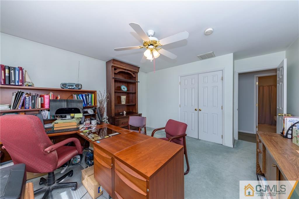 12 Thompson Bridge Road Jackson, NJ 08527 - Photo 18 of 25 a work room with furniture and book shelf