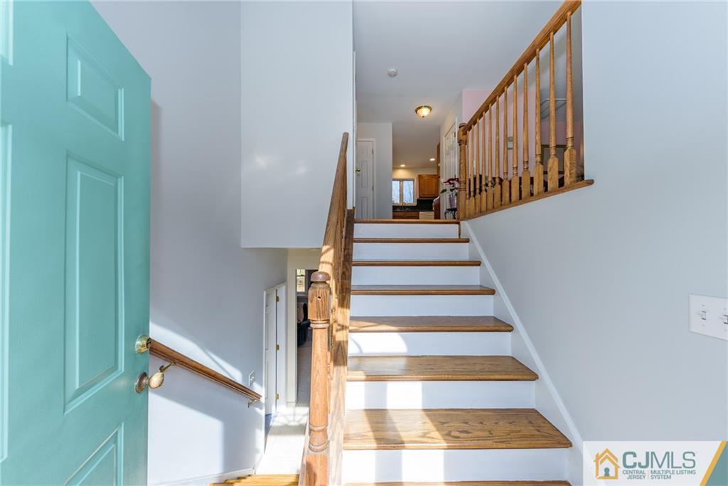 12 Thompson Bridge Road Jackson, NJ 08527 - Photo 3 of 25 a view of stairs and hall with wooden floor
