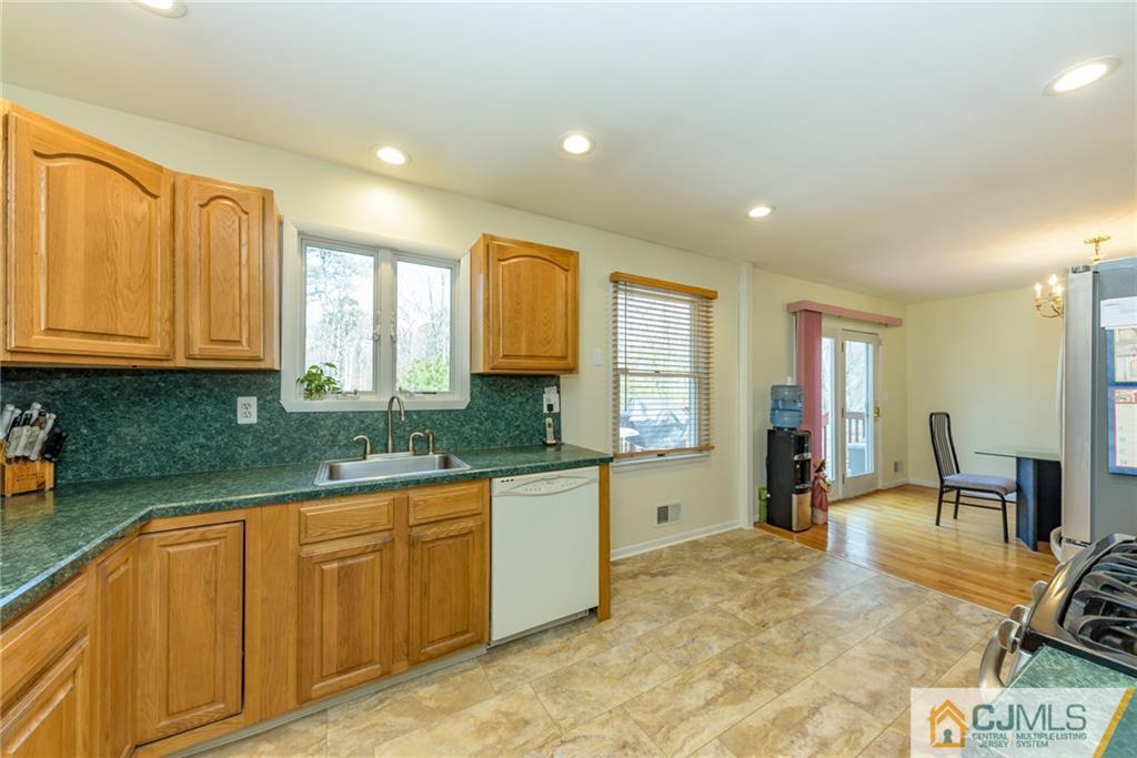 12 Thompson Bridge Road Jackson, NJ 08527 - Photo 9 of 25 a kitchen with granite countertop sink cabinets and window