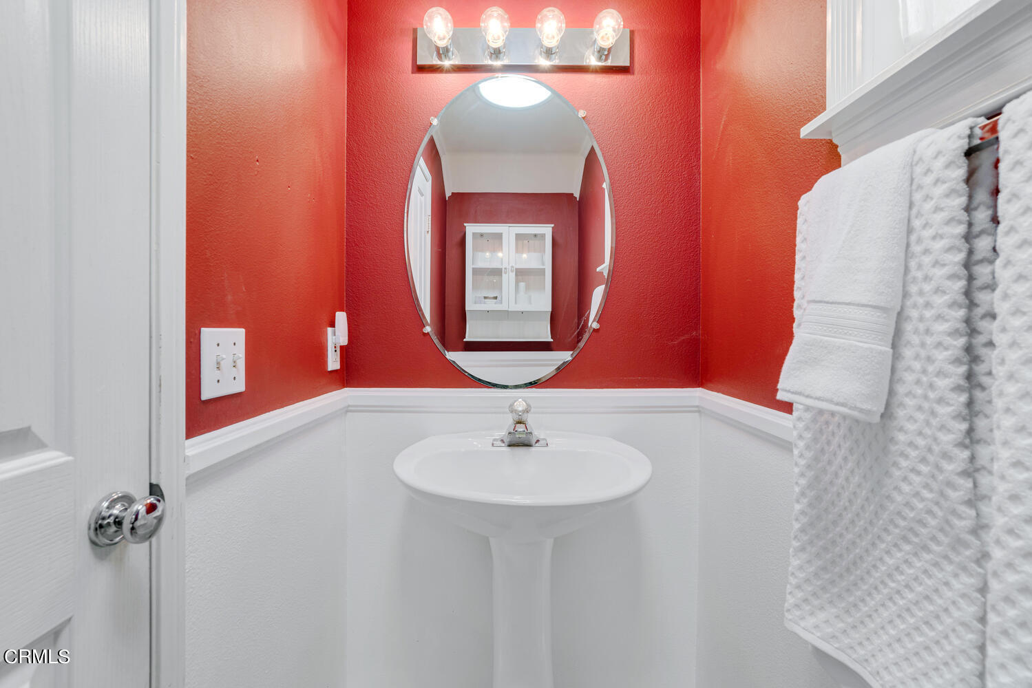 2911 Pico Place Oxnard, CA 93033 - Photo 12 of 25 a bathroom with a sink and a mirror