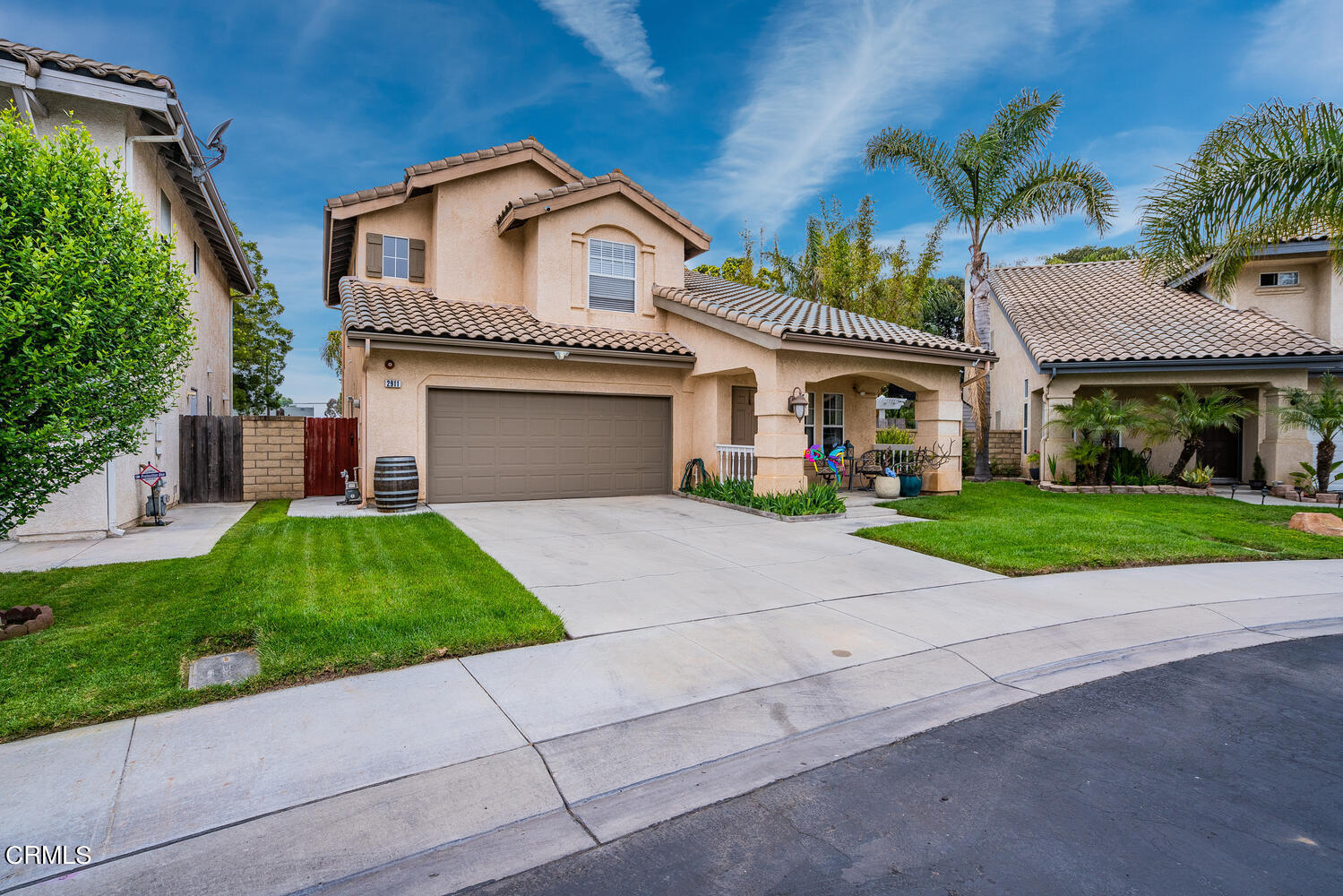 2911 Pico Place Oxnard, CA 93033 - Photo 25 of 25 a front view of a house with a yard and potted plants