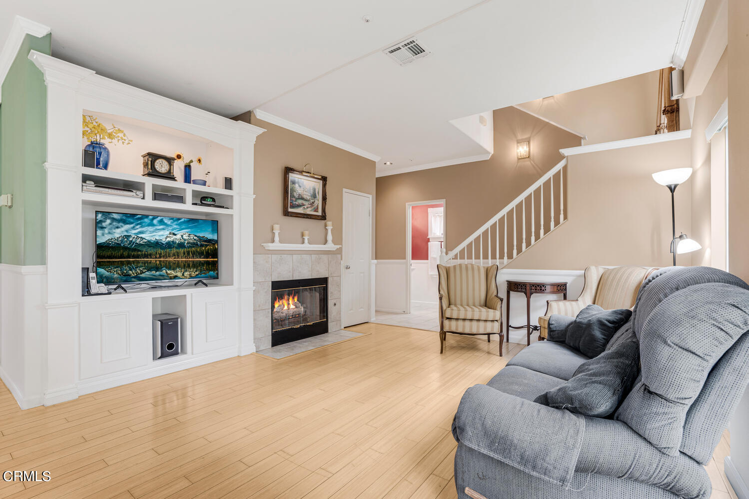 2911 Pico Place Oxnard, CA 93033 - Photo 10 of 25 a living room with furniture a fireplace and a flat screen tv