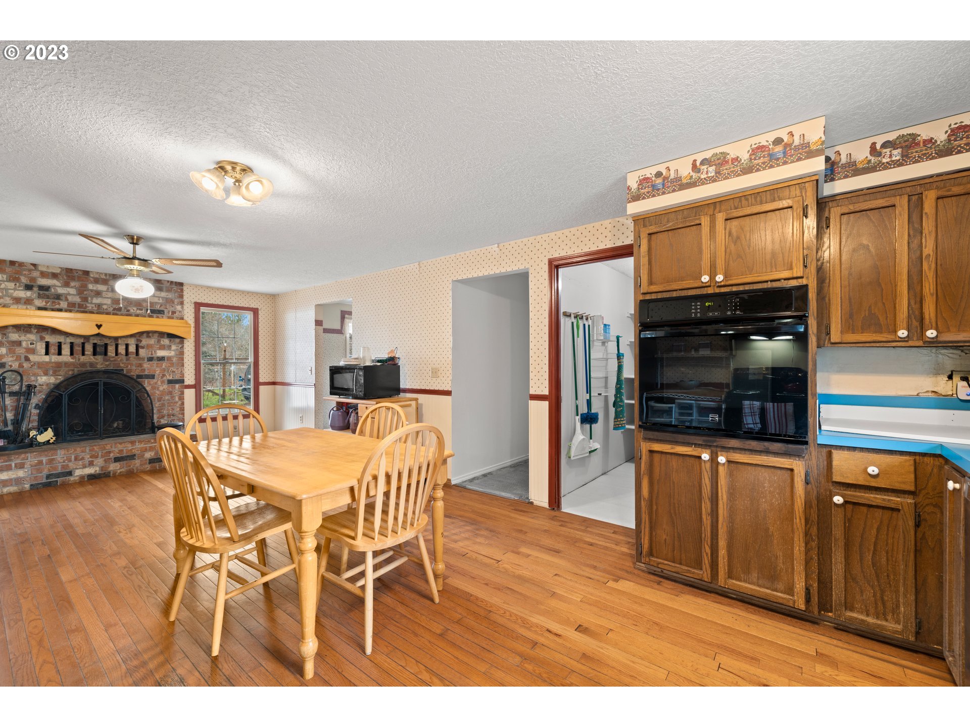 23231 South Engstrom Road Colton, OR 97017 - Photo 26 of 30 a kitchen with stainless steel appliances kitchen island granite countertop a refrigerator a stove a oven with white cabinets
