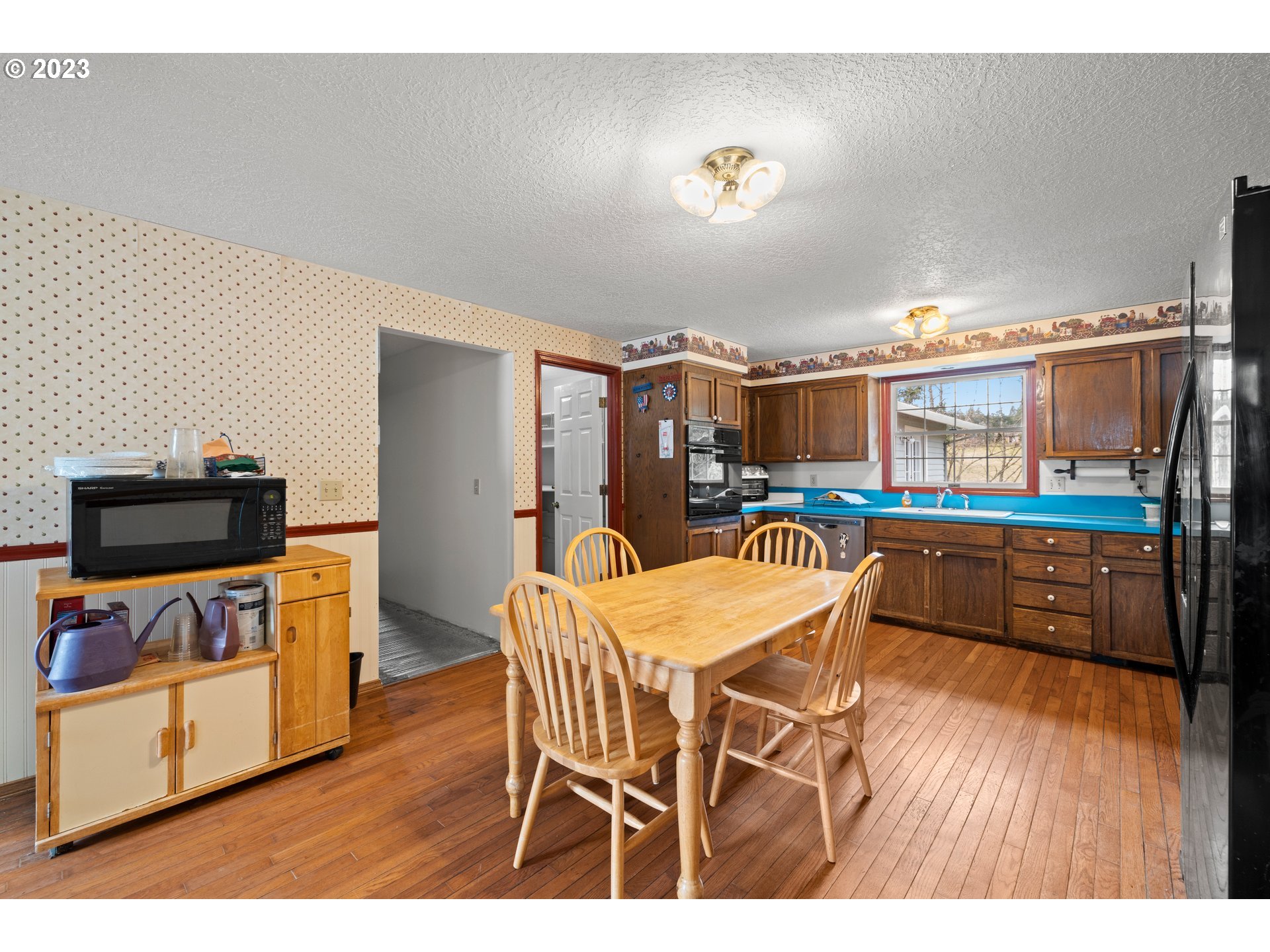 23231 South Engstrom Road Colton, OR 97017 - Photo 27 of 30 a dining room with furniture and wooden floor