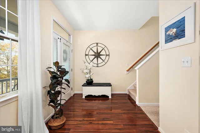 a view of a dining room with furniture wooden floor and a chandelier