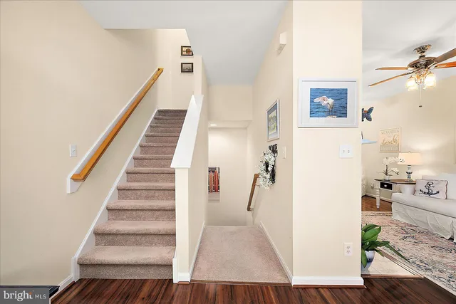 a kitchen with a refrigerator stove and white cabinets