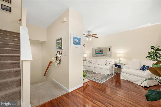 a kitchen with granite countertop white cabinets and stainless steel appliances
