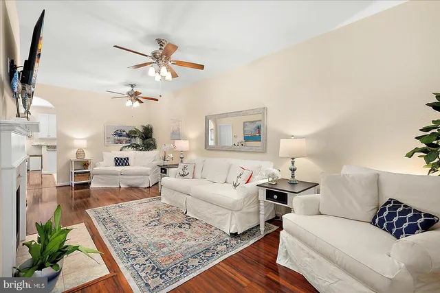 a kitchen with granite countertop white cabinets and stainless steel appliances