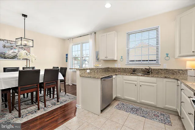 a bathroom with a sink a toilet and shower curtain