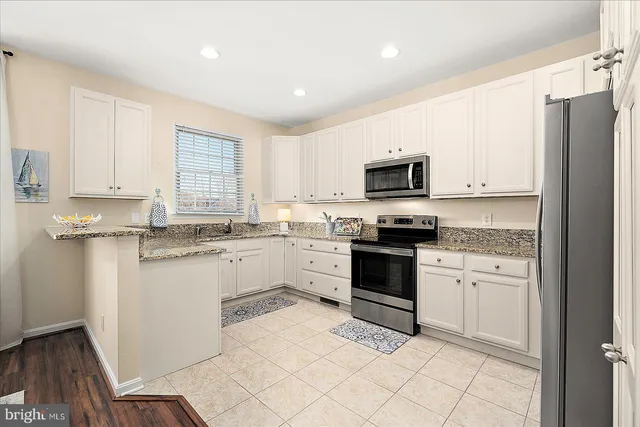a bathroom with a toilet a sink and a mirror