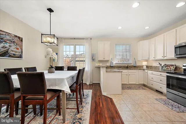 a view of a yard with wooden fence