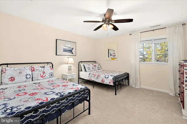 a view of a two chairs and a table in a yard