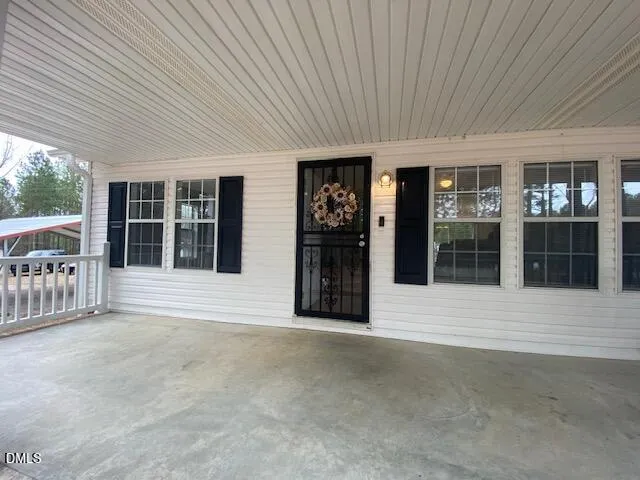 a view of the house with large windows