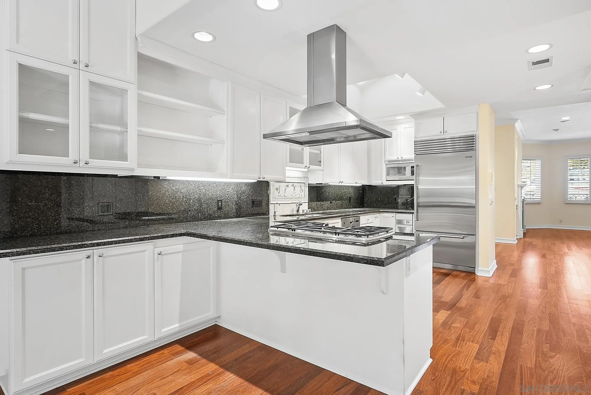 7836 Ivanhoe Avenue La Jolla, CA 92037 - Photo 13 of 31 a kitchen with granite countertop a stove and a sink