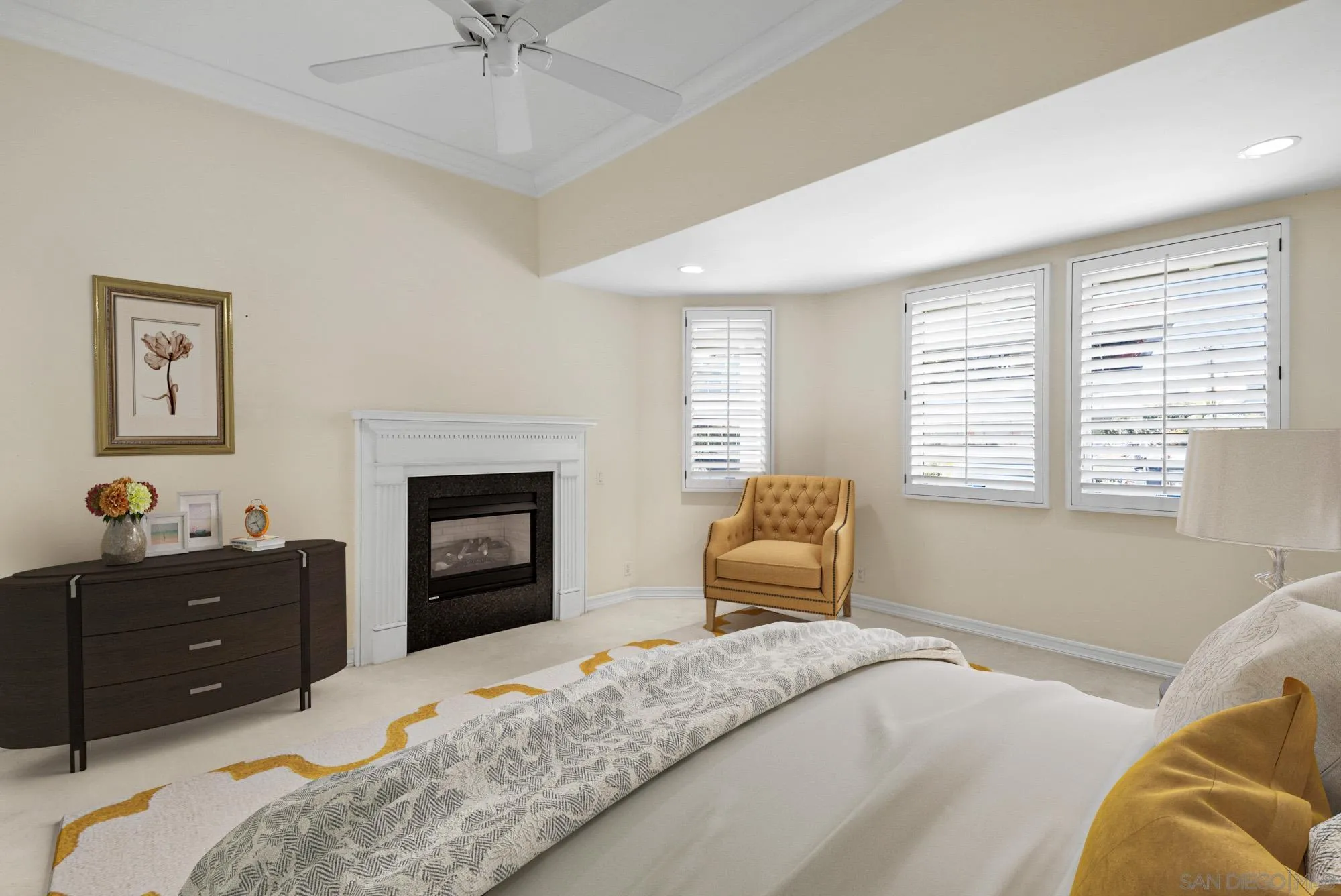 7836 Ivanhoe Avenue La Jolla, CA 92037 - Photo 16 of 31 a bedroom with a bed and a fireplace