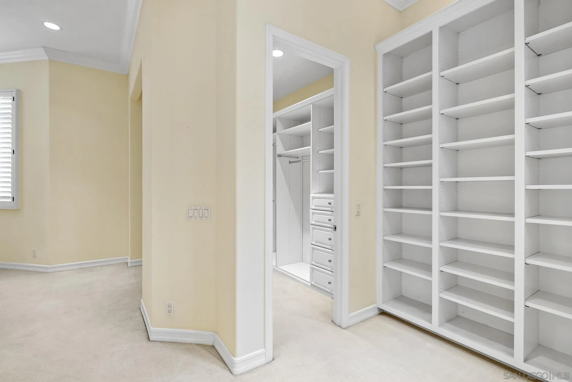 7836 Ivanhoe Avenue La Jolla, CA 92037 - Photo 20 of 31 a view of an empty room with empty shelves