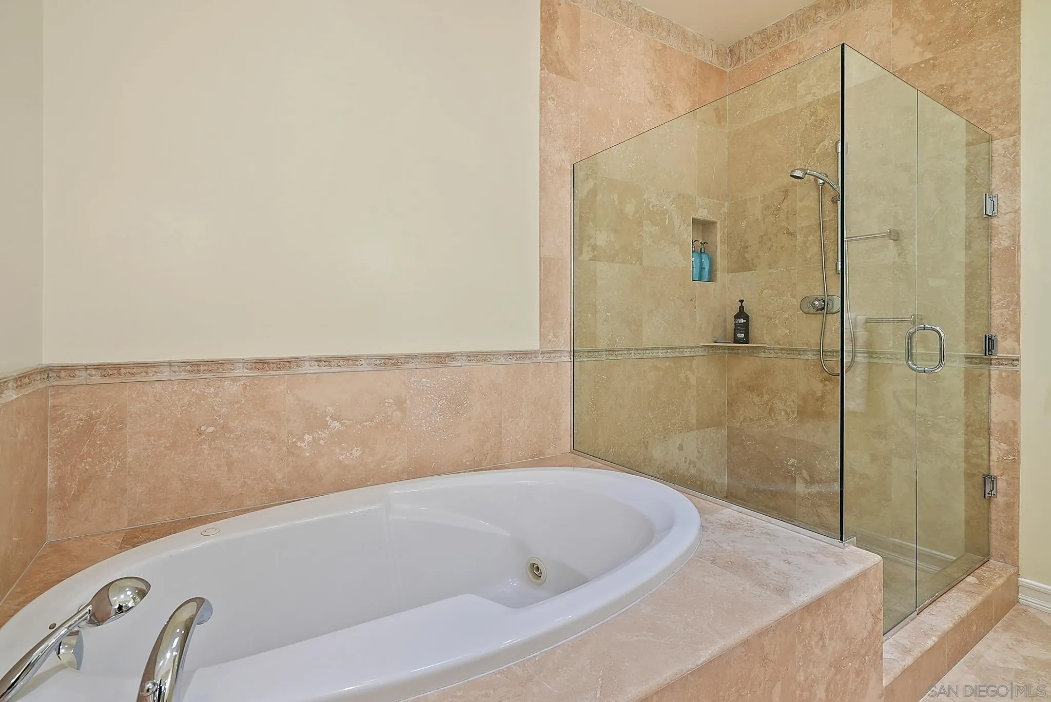 7836 Ivanhoe Avenue La Jolla, CA 92037 - Photo 22 of 31 a bathroom with a bathtub and shower