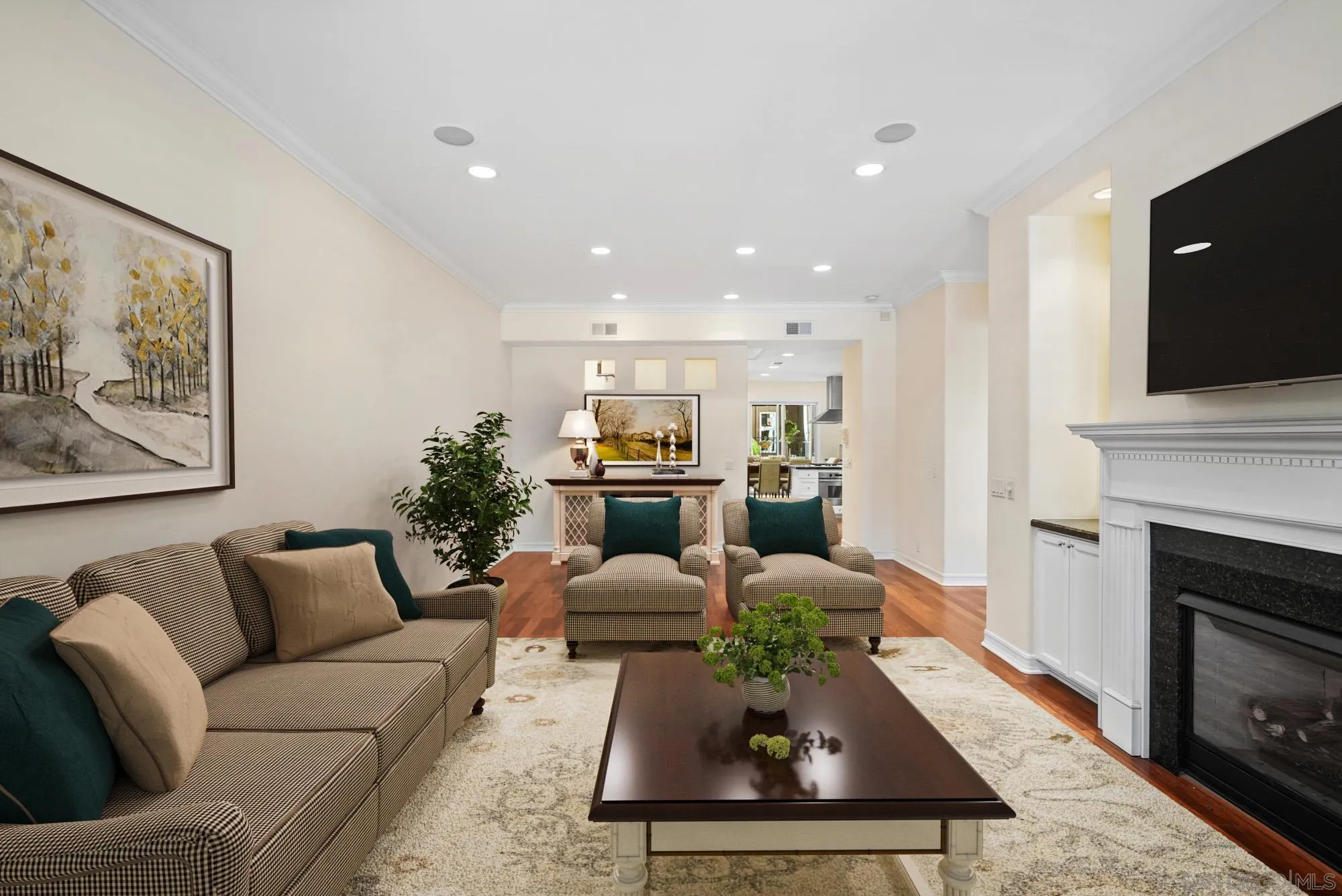7836 Ivanhoe Avenue La Jolla, CA 92037 - Photo 4 of 31 a living room with furniture and a fireplace