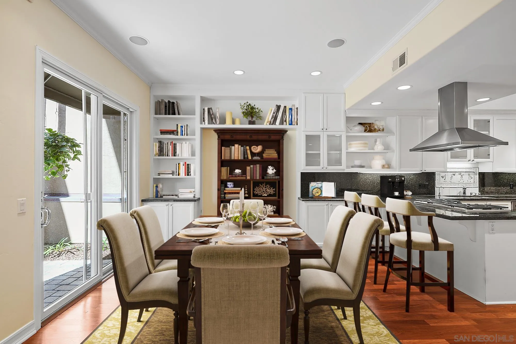 7836 Ivanhoe Avenue La Jolla, CA 92037 - Photo 6 of 31 a dining room with furniture and a floor to ceiling window