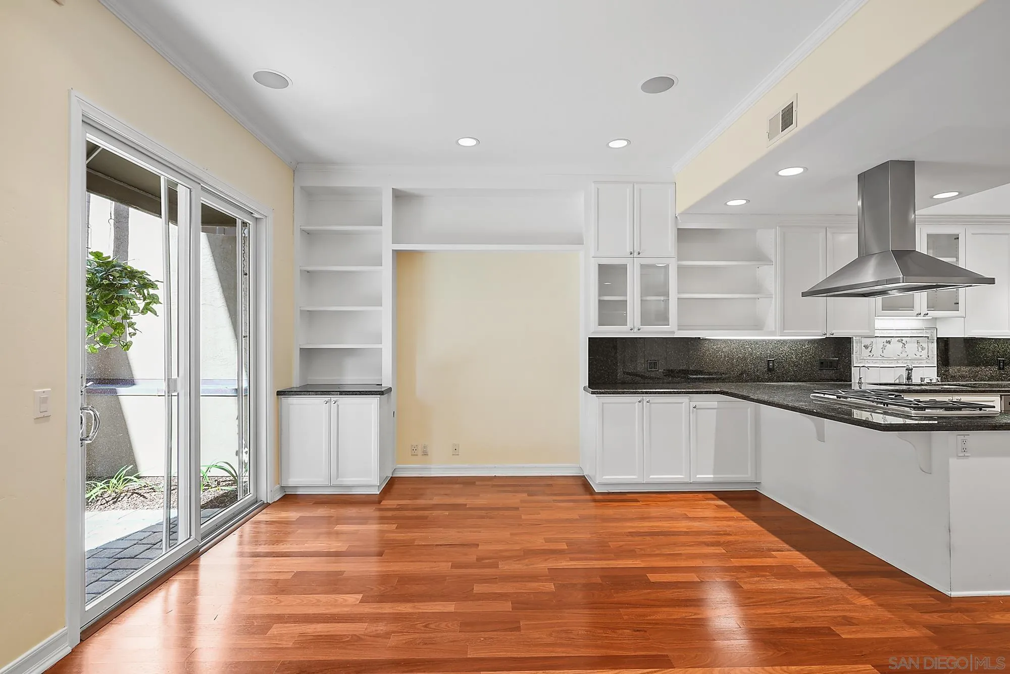 7836 Ivanhoe Avenue La Jolla, CA 92037 - Photo 7 of 31 a kitchen with stainless steel appliances granite countertop a sink and a stove