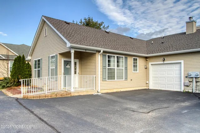 a front view of a house with a garage