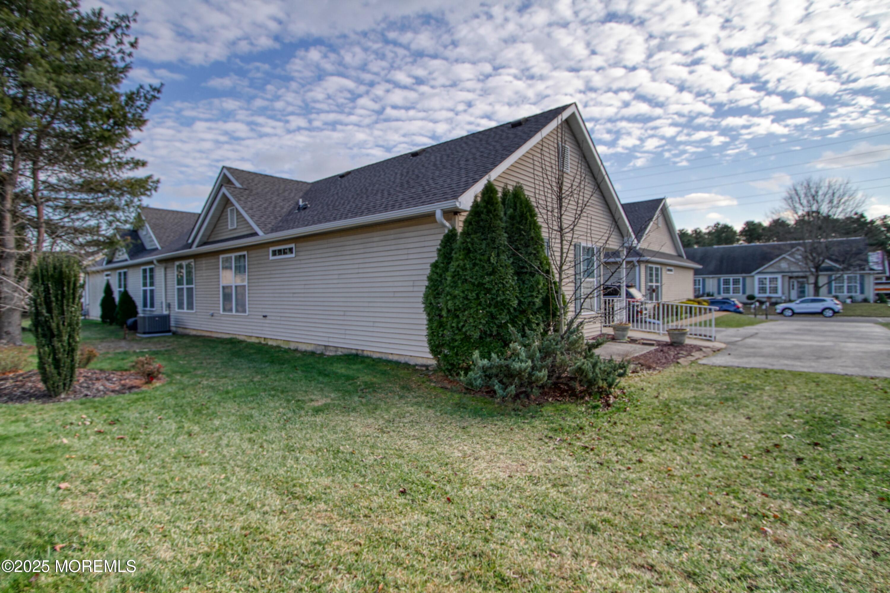 32 Winkle Court Whiting, NJ 08759 - Photo 11 of 18 a backyard of a house with lots of green space