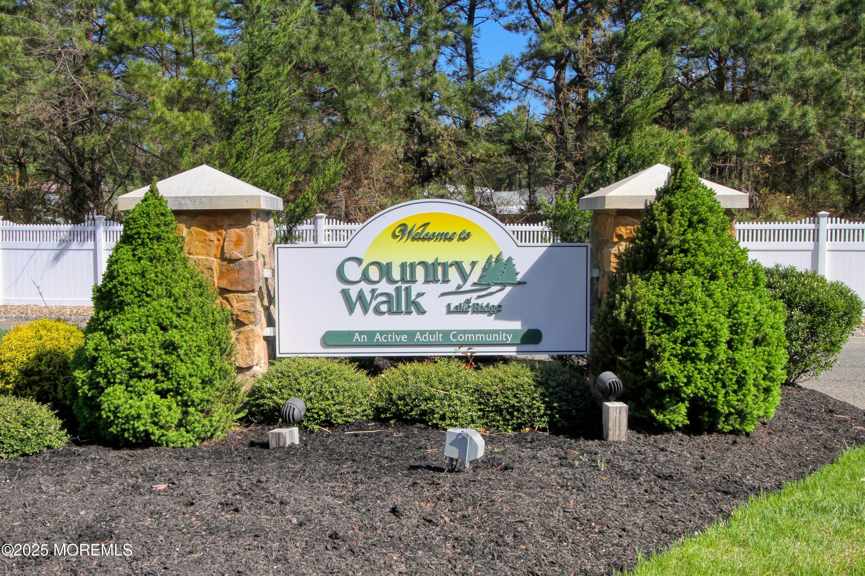 32 Winkle Court Whiting, NJ 08759 - Photo 12 of 18 a sign that is sitting in front of flowers