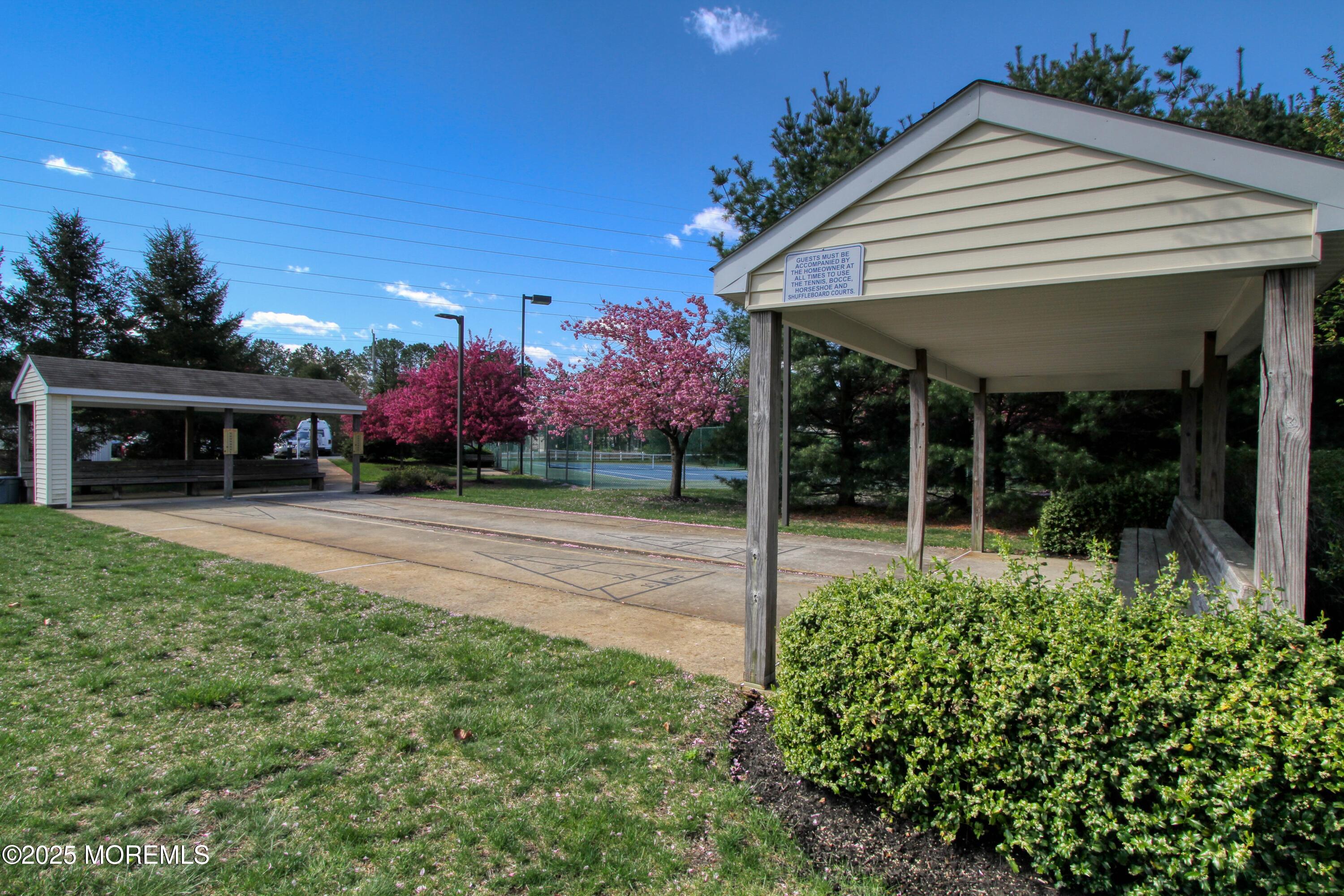 32 Winkle Court Whiting, NJ 08759 - Photo 16 of 18 a view of a house with porch and garden