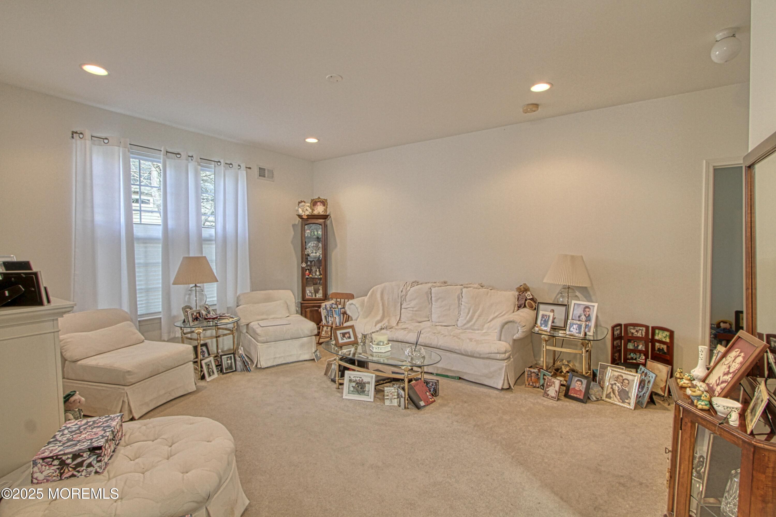 32 Winkle Court Whiting, NJ 08759 - Photo 4 of 18 a living room with furniture and a large window