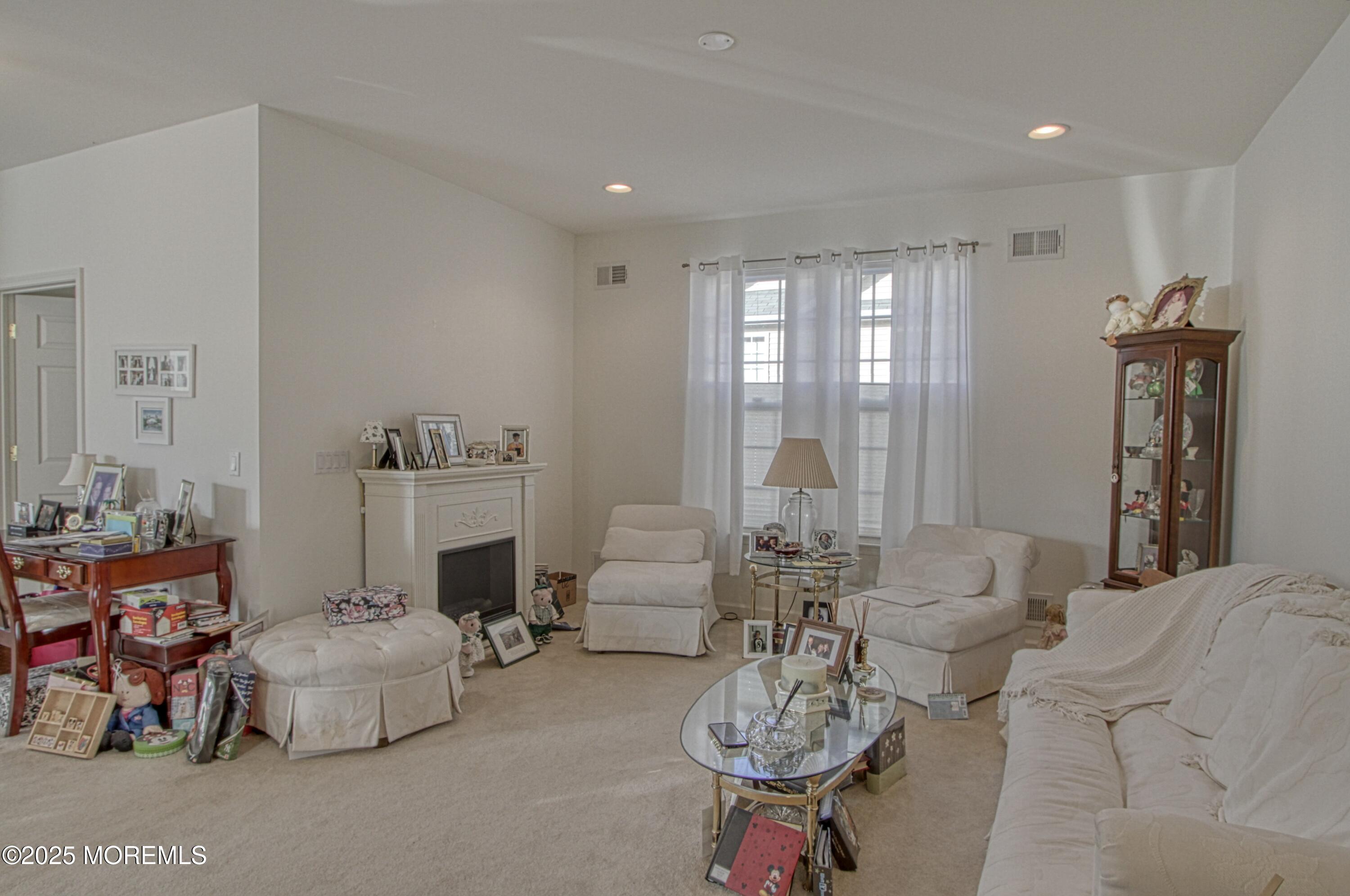 32 Winkle Court Whiting, NJ 08759 - Photo 5 of 18 a living room with furniture and a large window