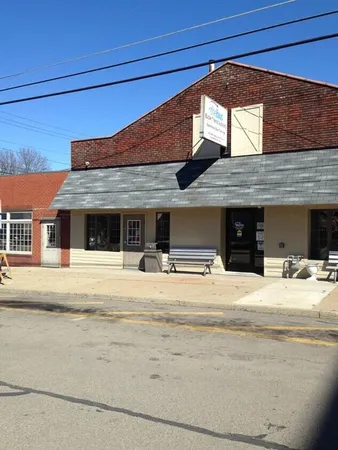 a view of room with a wooden floor and a window