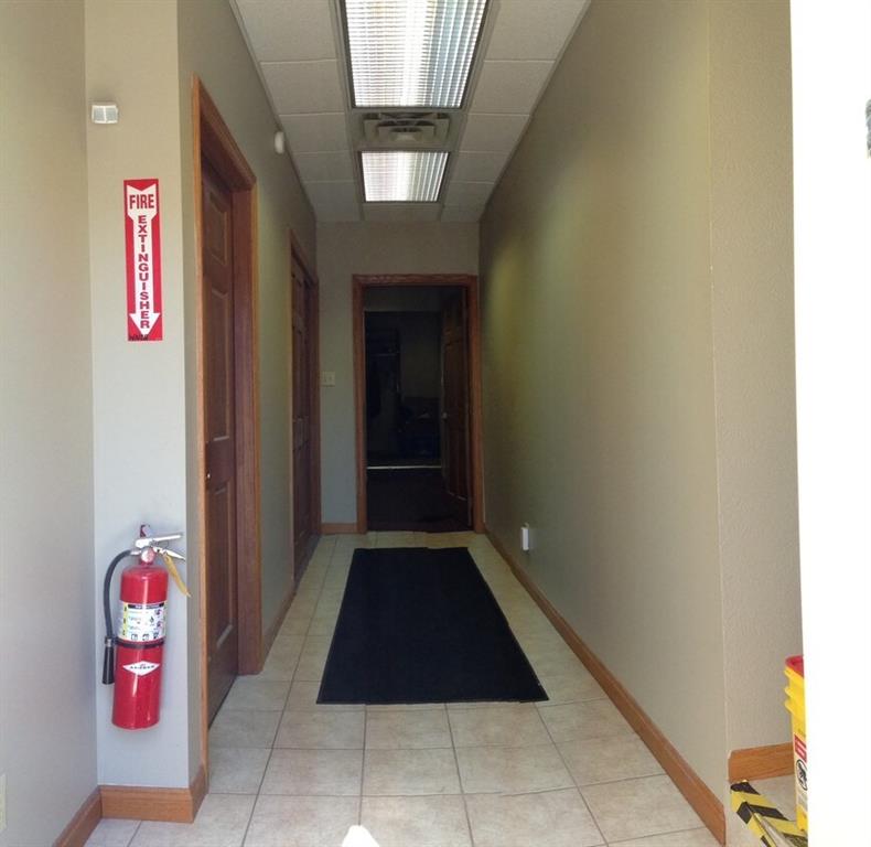 132 West New Castle Street, Unit 1 Butler, PA 16001 - Photo 6 of 8 a room with a bench and a potted plant