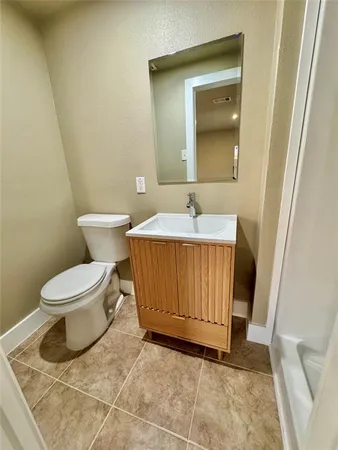 a bathroom with a toilet and a sink
