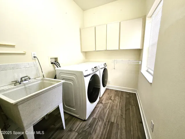 a utility room with dryer and washer
