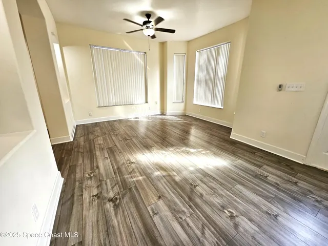 a view of entryway with wooden floor