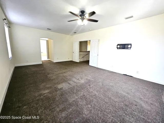 a view of a big room with carpet