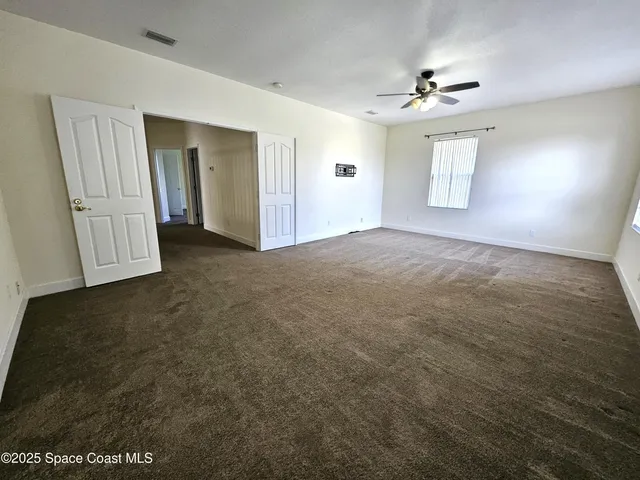 a view of empty room with windows