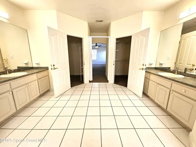 a view of hallway with wooden floor