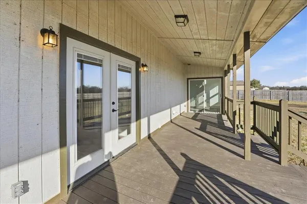 a view of a balcony with furniture