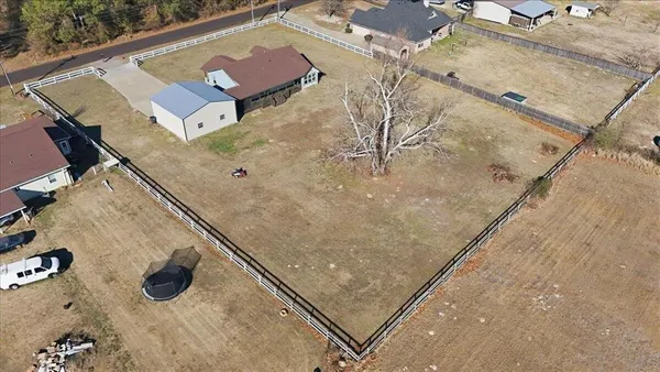 an aerial view of residential house with outdoor space