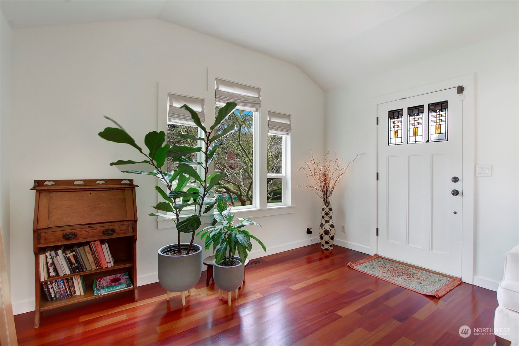 2733 49th Avenue Southwest Seattle, WA 98116 - Photo 2 of 32 a living room with furniture and a potted plant