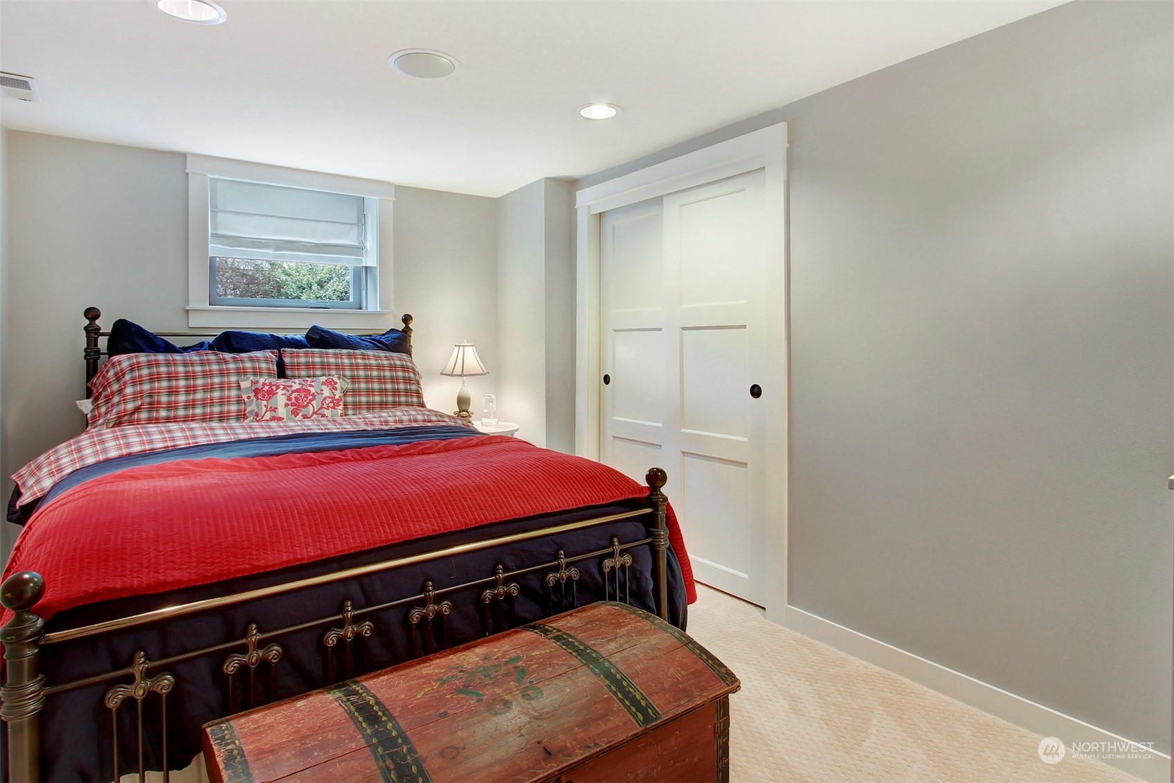 2733 49th Avenue Southwest Seattle, WA 98116 - Photo 24 of 32 a bedroom with a bed and a window