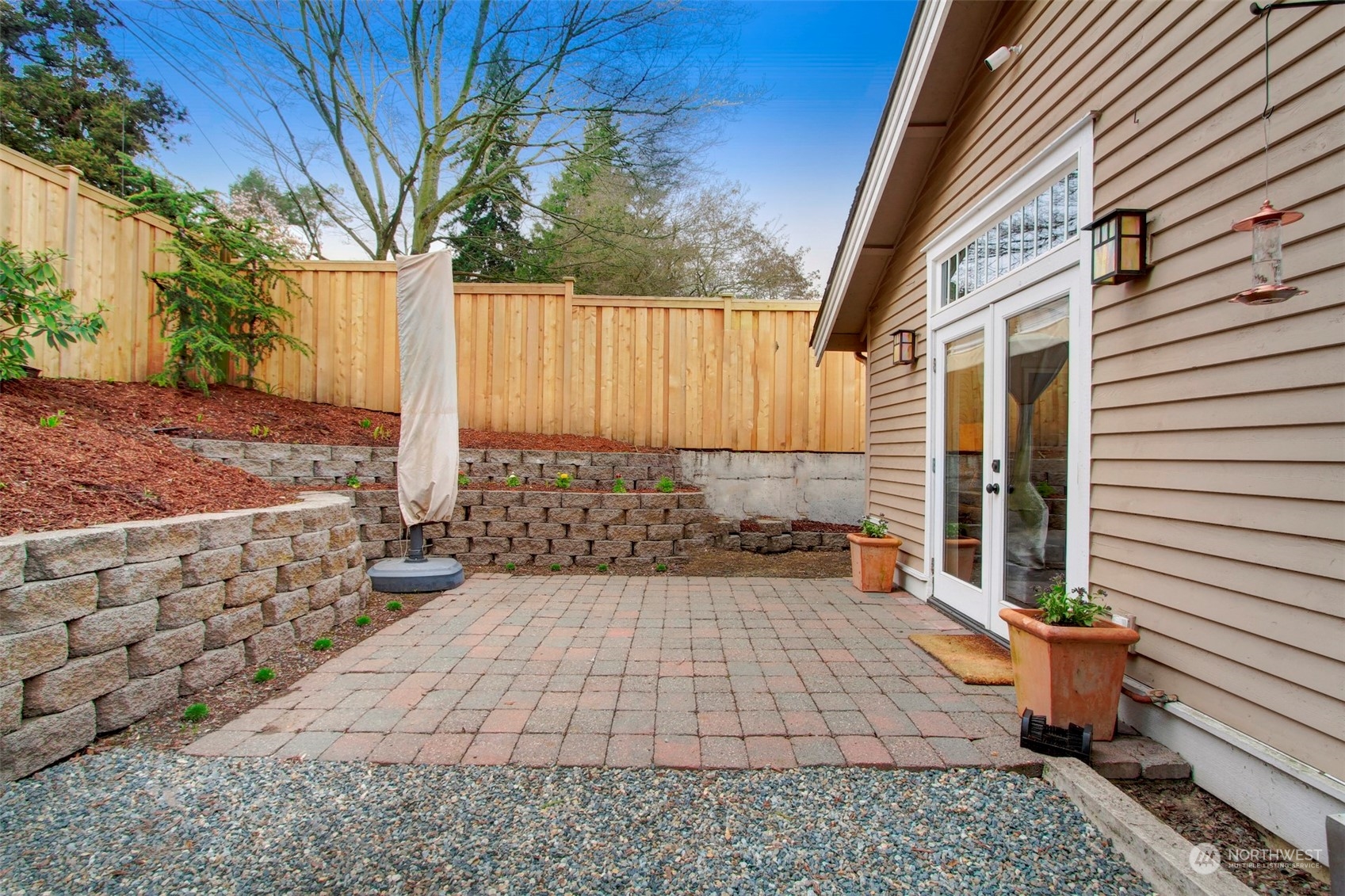 2733 49th Avenue Southwest Seattle, WA 98116 - Photo 30 of 32 a backyard of a house with outdoor seating