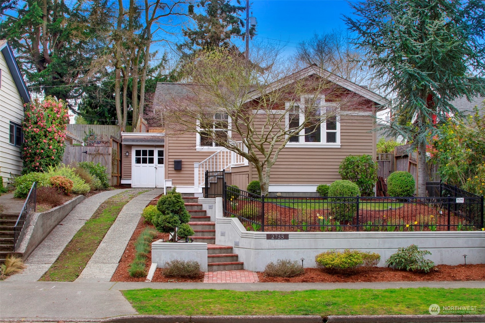 2733 49th Avenue Southwest Seattle, WA 98116 - Photo 32 of 32 a front view of house with yard and green space