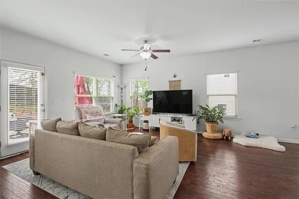 a living room with furniture and a flat screen tv