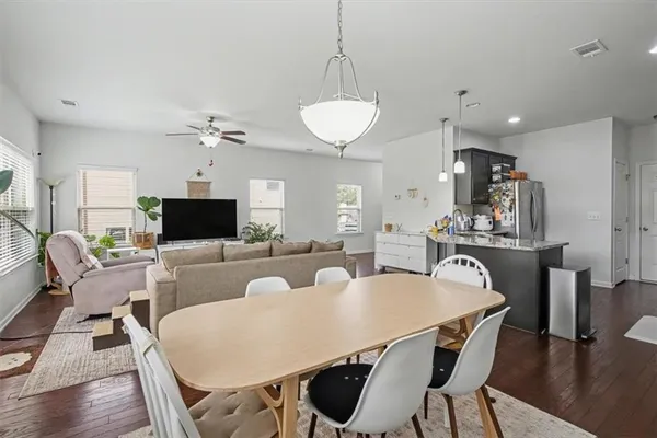 a view of a dining room with furniture and wooden floor